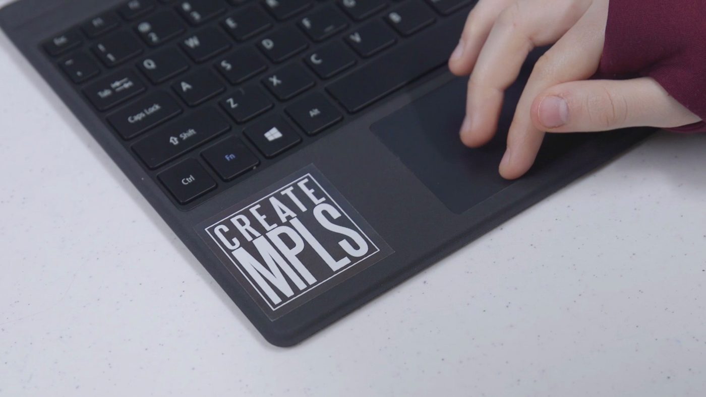 An old CREATE MPLS sticker on a student's laptop.